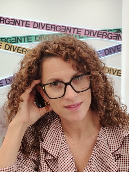 gafas de vista en acetato verde petróleo con forma trapezoidal y detalles metálicos dorados