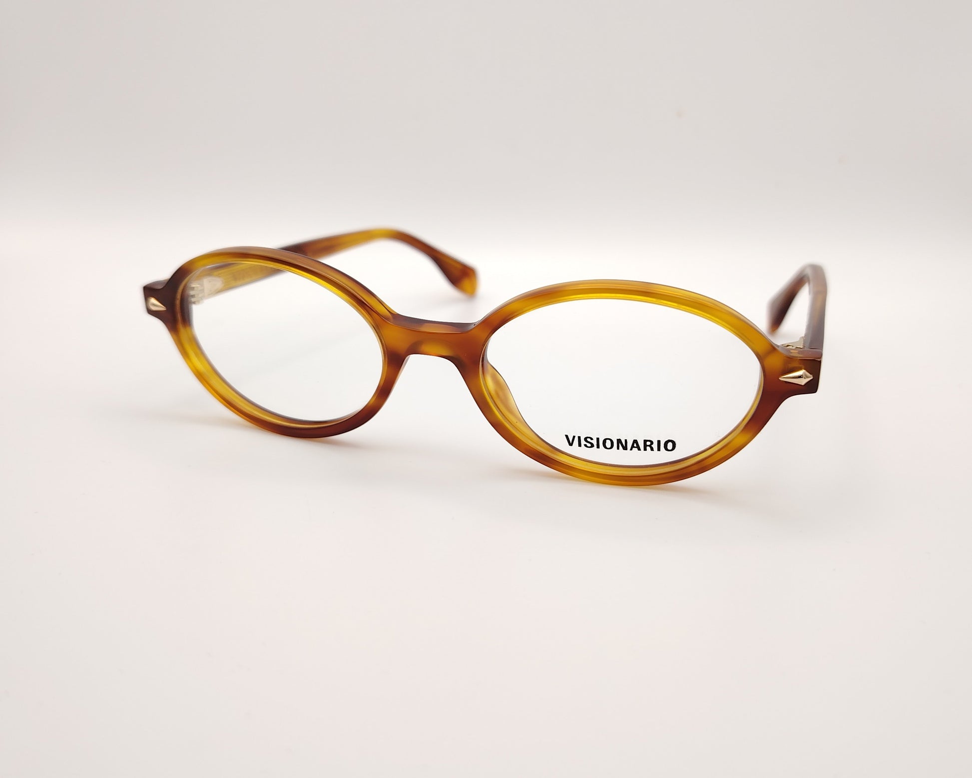 gafas de vista redondas en acetato ámbar con detalles metálicos dorados de la marca visionario