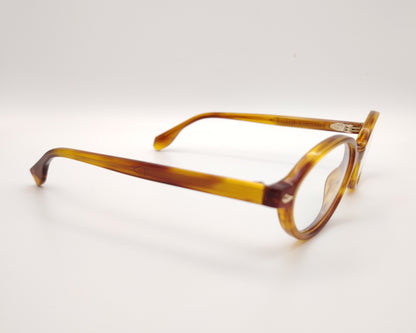 gafas de vista ovaladas en acetato ámbar con detalles metálicos dorados de la marca visionario