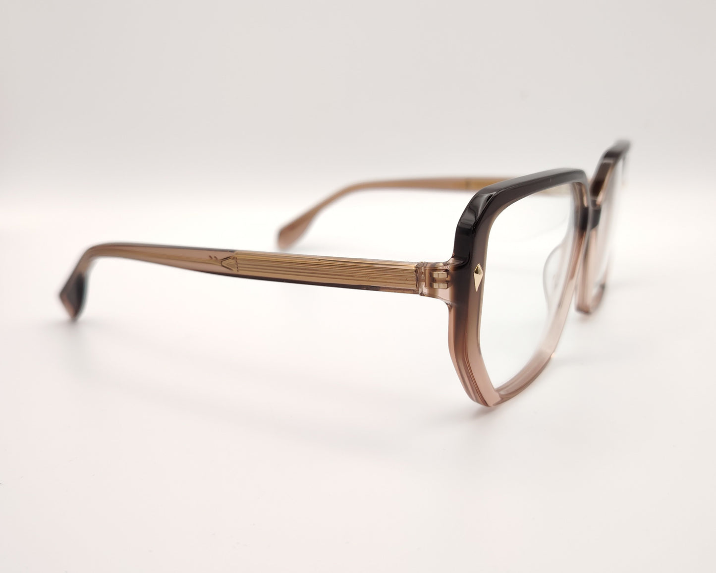 gafas de vista octogonales en acetato degradado marrón claro a oscuro con detalles metálicos dorados