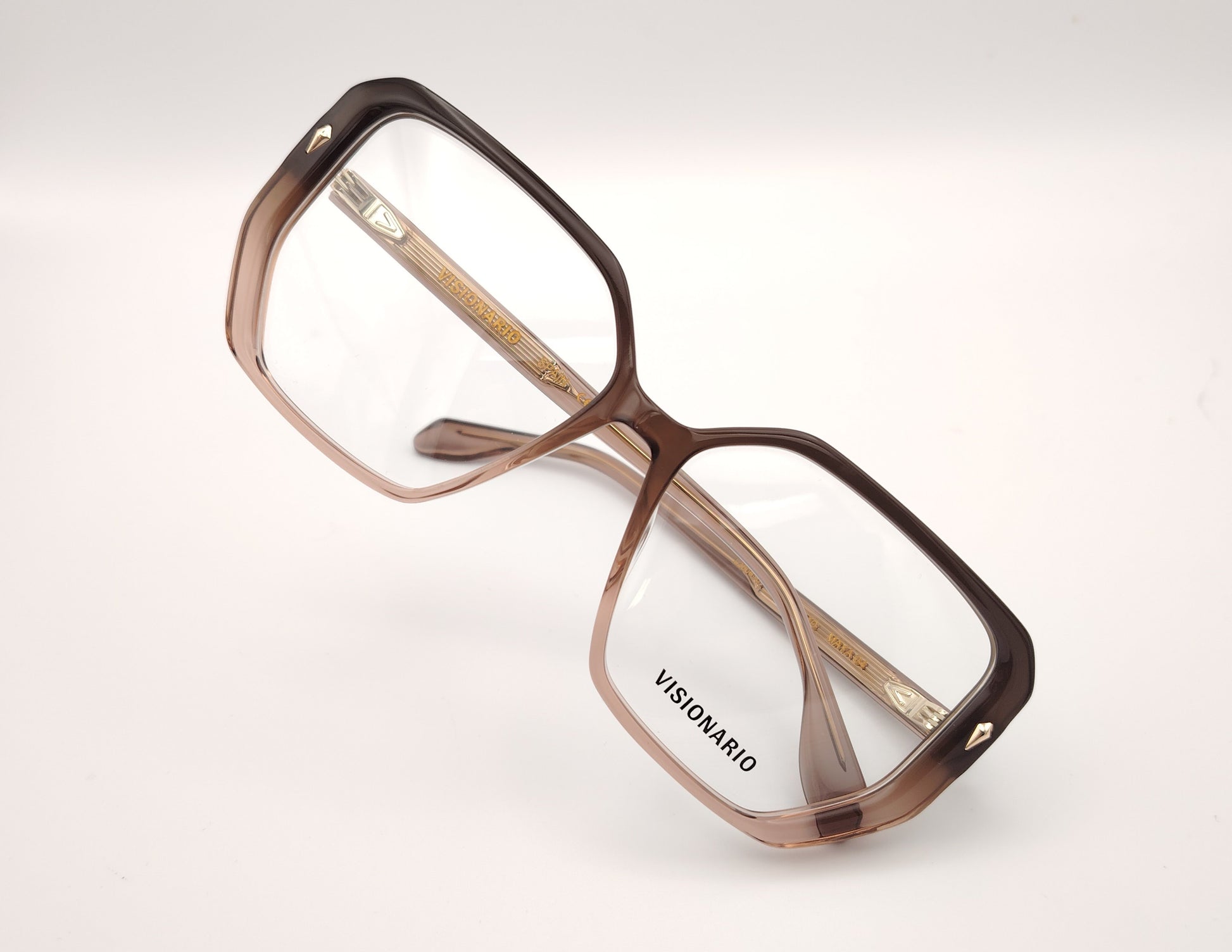 gafas de vista octogonales en acetato degradado marrón claro a oscuro con detalles metálicos dorados