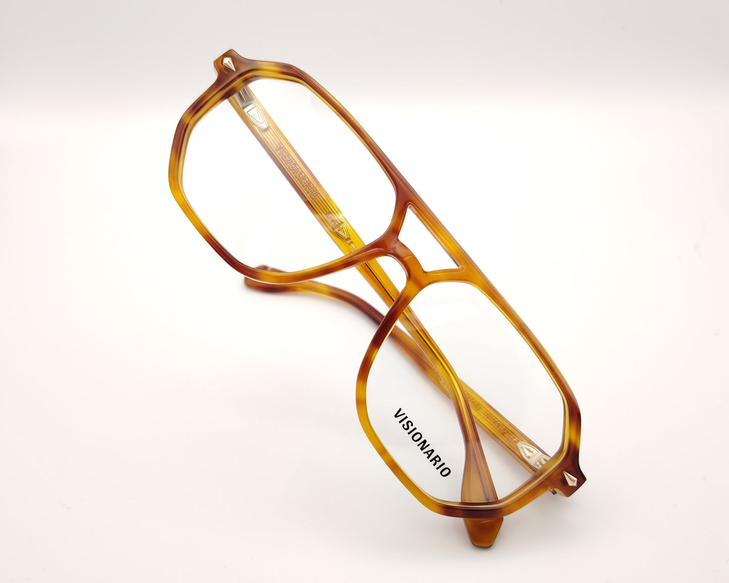 gafas de vista estilo aviador en acetato ámbar con diseño geométrico