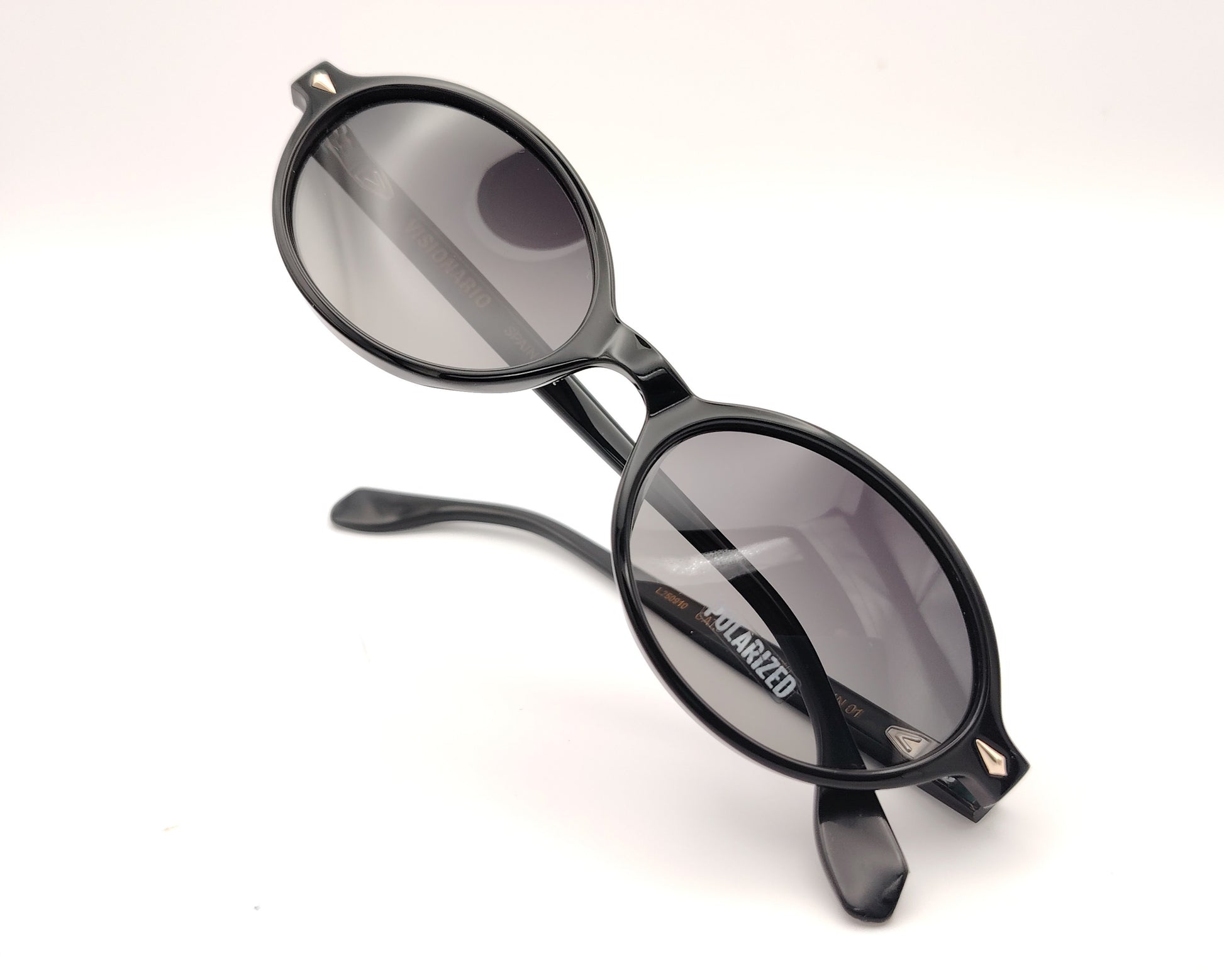 gafas de sol visionario negras ovaladas con lentes polarizadas oscuras
