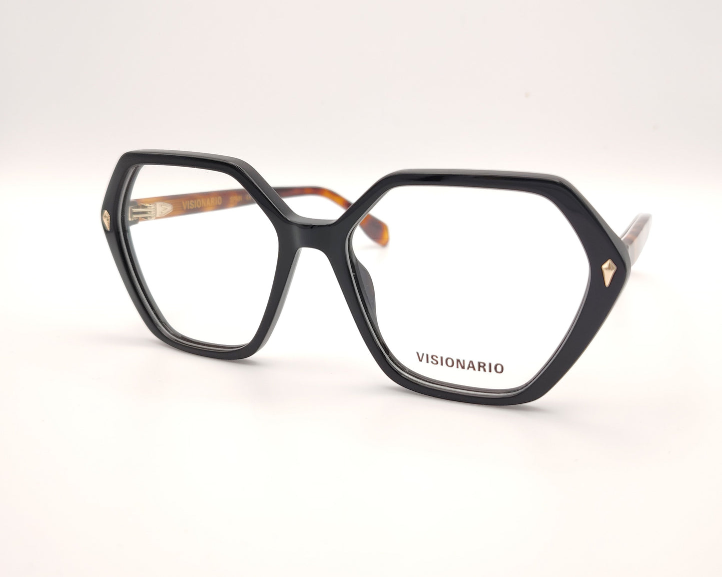 gafas con forma hexagonal y frontal negro con varillas en carey ámbar marca visionario