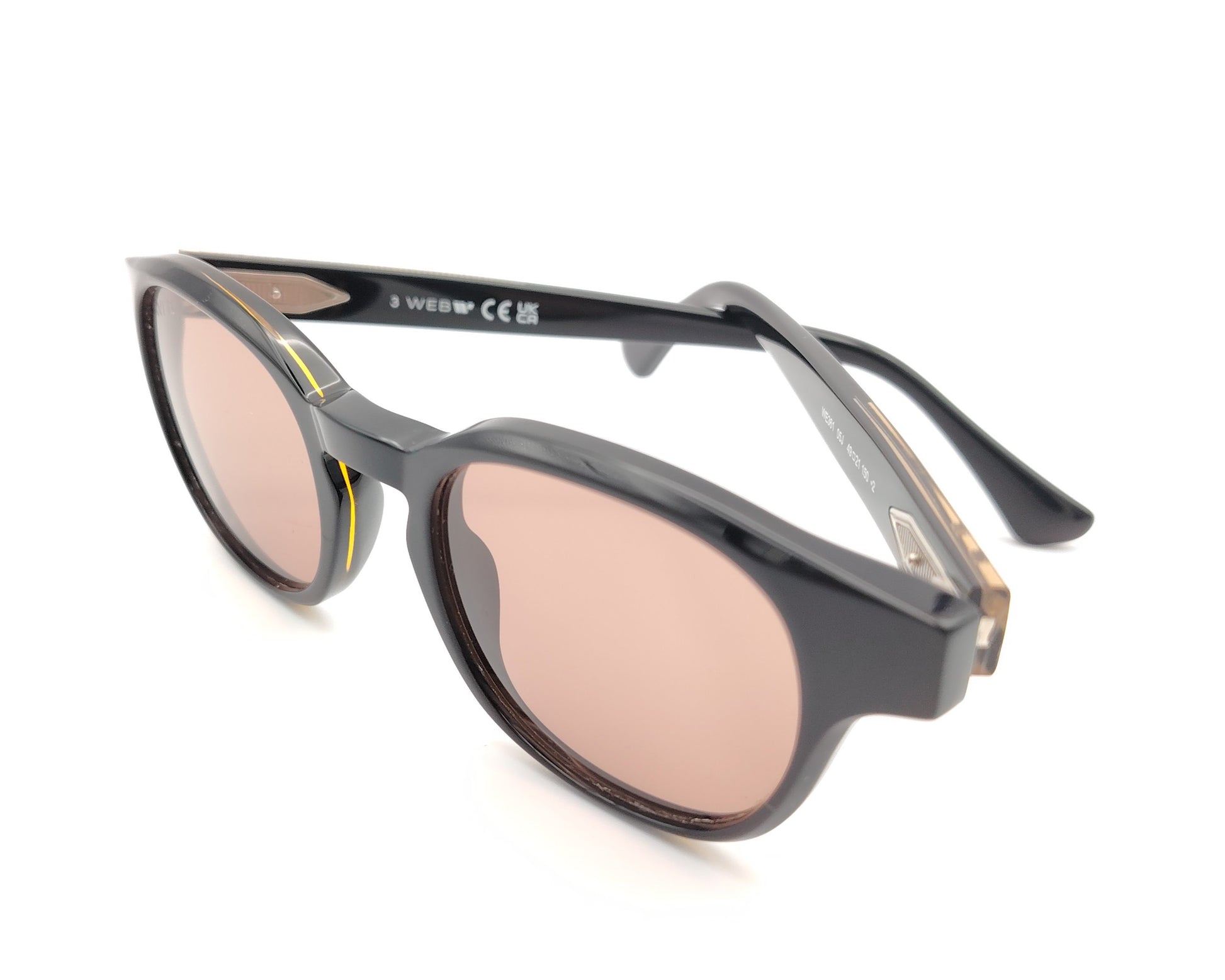gafas de sol web eyewear con montura de acetato negro, puente metálico dorado y lentes marrones