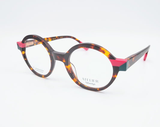 gafas graduadas woodys absinthe 02 redondas carey con detalles en rosa fucsia y verde

