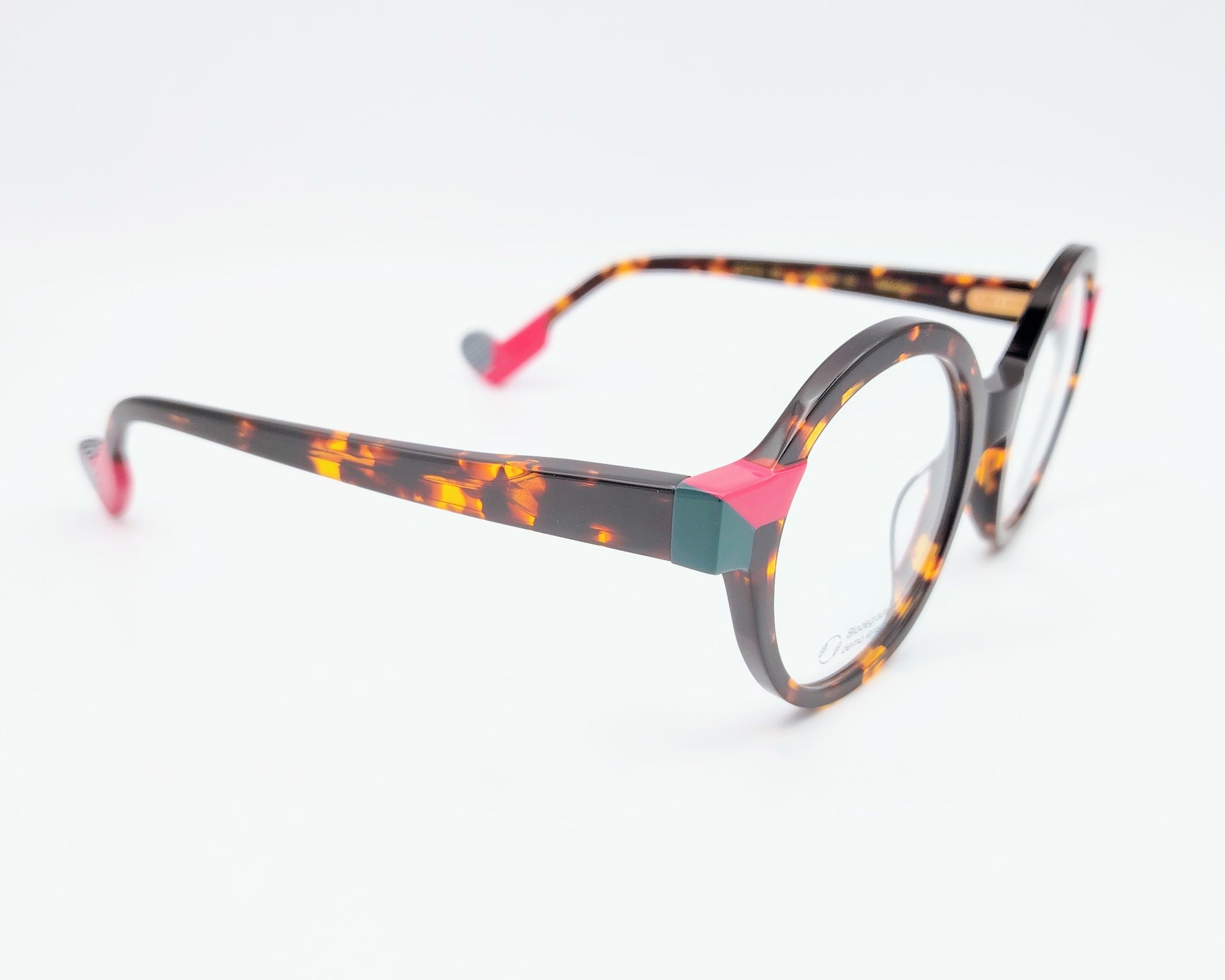 gafas graduadas woodys absinthe 02 redondas carey con detalles en rosa fucsia y verde


