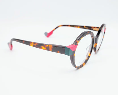 gafas graduadas woodys absinthe 02 redondas carey con detalles en rosa fucsia y verde

