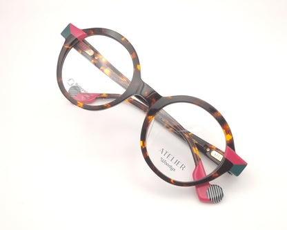 gafas graduadas woodys absinthe 02 redondas carey con detalles en rosa fucsia y verde

