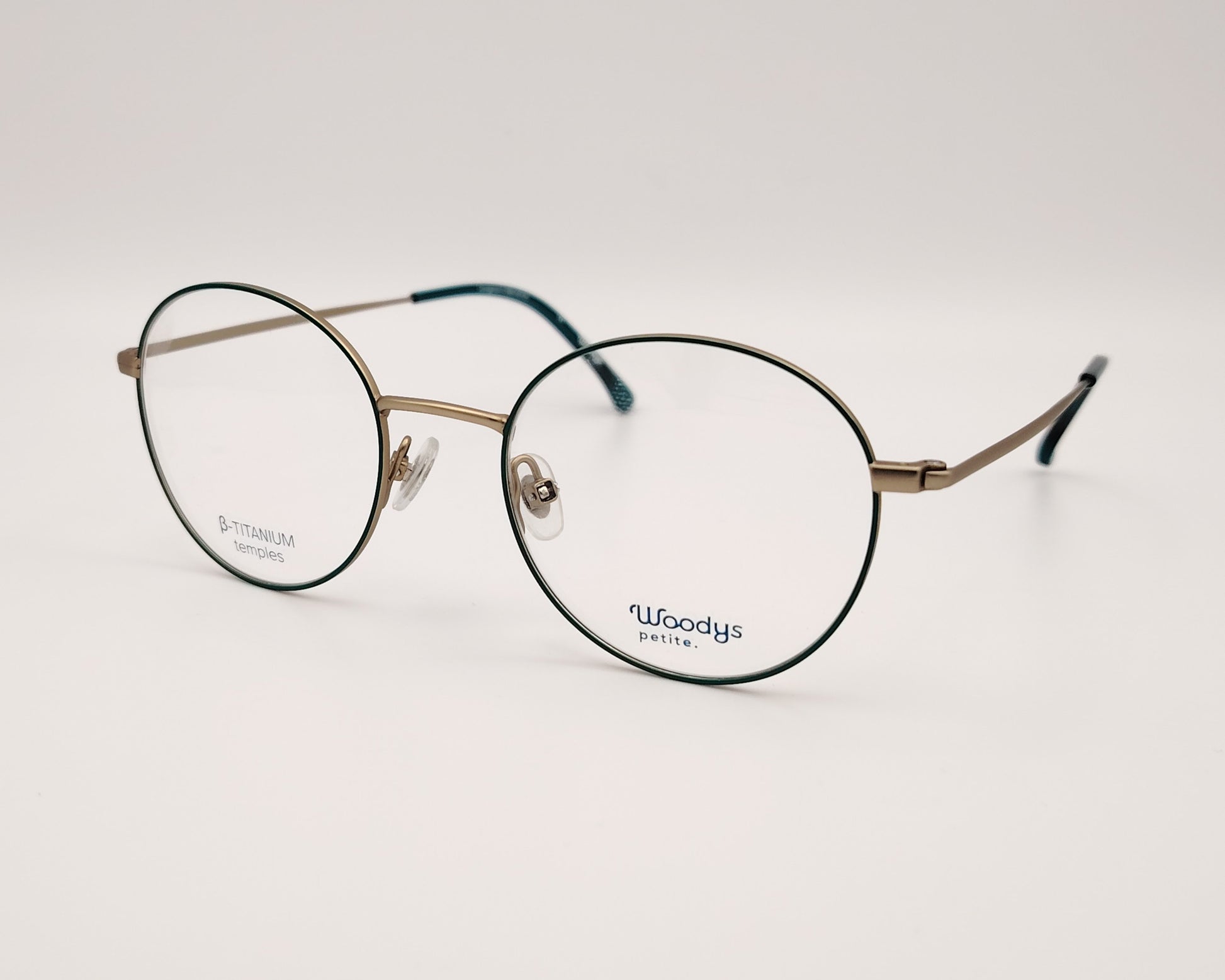gafas woodys alix 03 de titanio dorado con lacado verde y forma redonda 