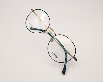 gafas woodys alix 03 de titanio dorado con lacado verde y forma redonda 