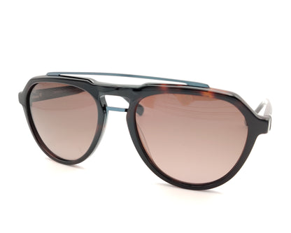 gafas de sol estilo aviador en acetato carey con lentes marrones polarizadas y detalle azul en el puente