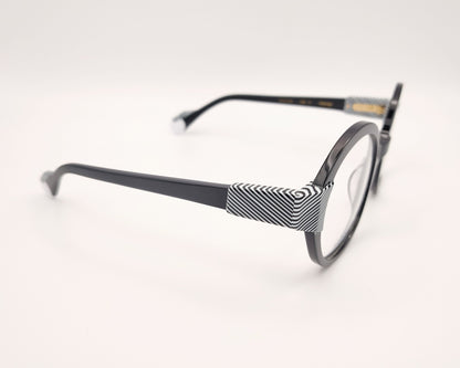 gafas woodys kiss 01 montura de acetato redonda negra detalles geométricos blanco y negro diseño elegante y moderno