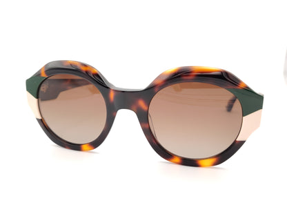 gafas de sol redondas carey con detalles en verde oscuro y crema en los extremos