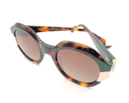 gafas de sol redondas carey con detalles en verde oscuro y crema en los extremos