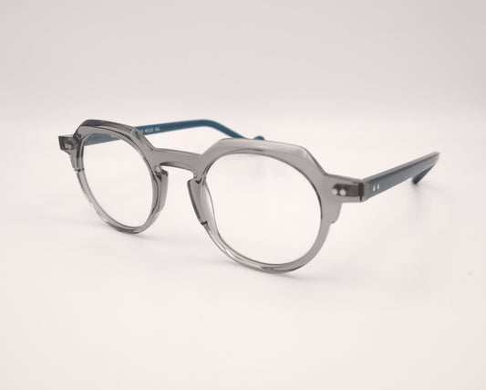 gafas redondas gris translúcido con varillas azul oscuro y estilo retro moderno