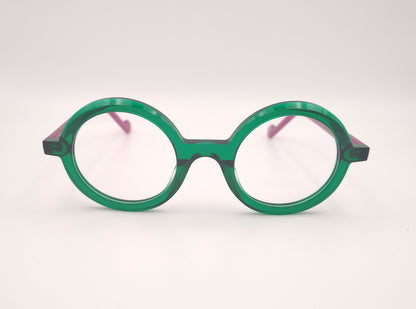 gafas graduadas xit v117 redondas con frontal verde transparente y varillas fucsia
